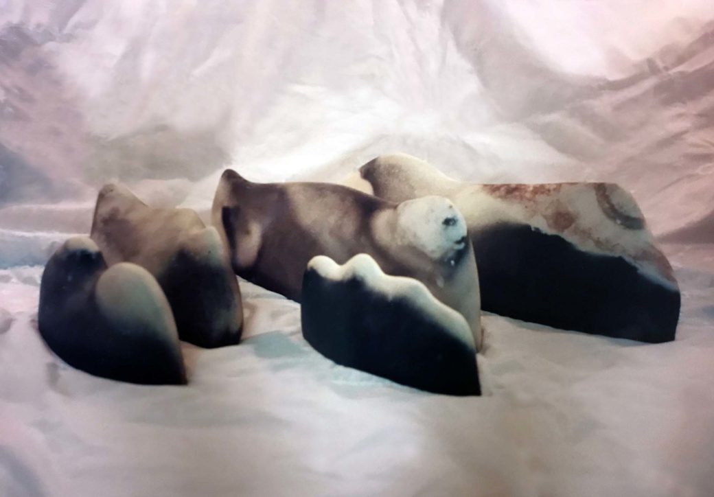 Five ceramic pieces that resemble a seascape